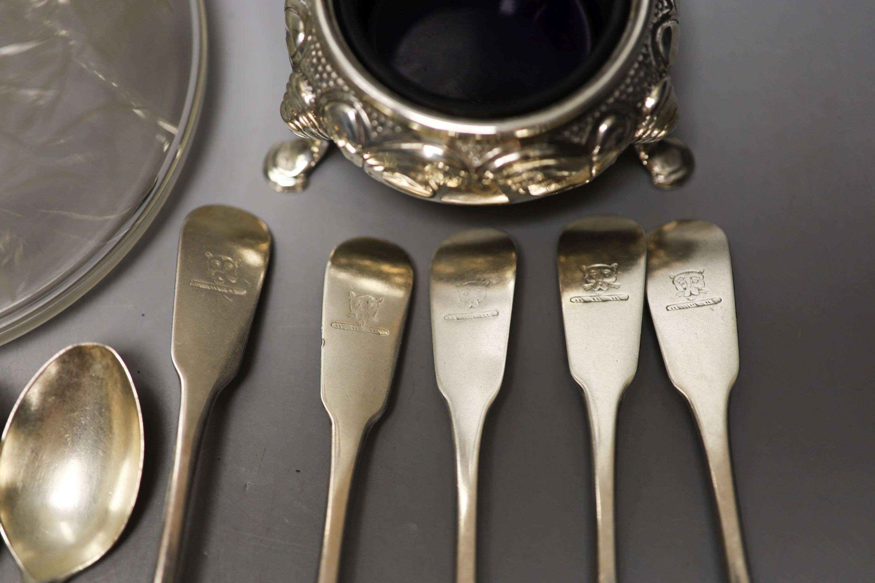 Five 19th century Irish silver fiddle pattern teaspoons, by Isaacs, two similar Scottish teaspoons, a pair if silver napkin rings, a Victorian silver bun salt and a silver plate mounted glass claret jug.